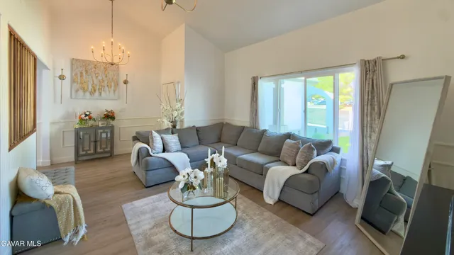 a living room with furniture or couch and a wooden floor