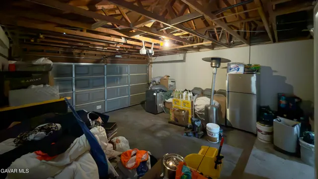 a dining room with furniture and a garden
