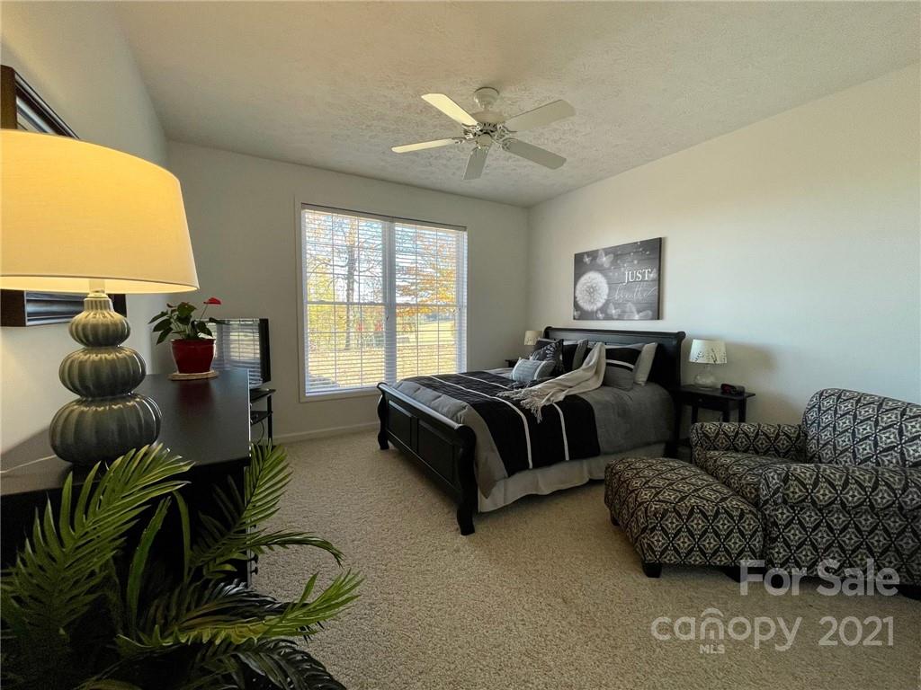 85 Moore Road Tryon, NC 28782 - Photo 13 of 20 a spacious bedroom with a bed and window