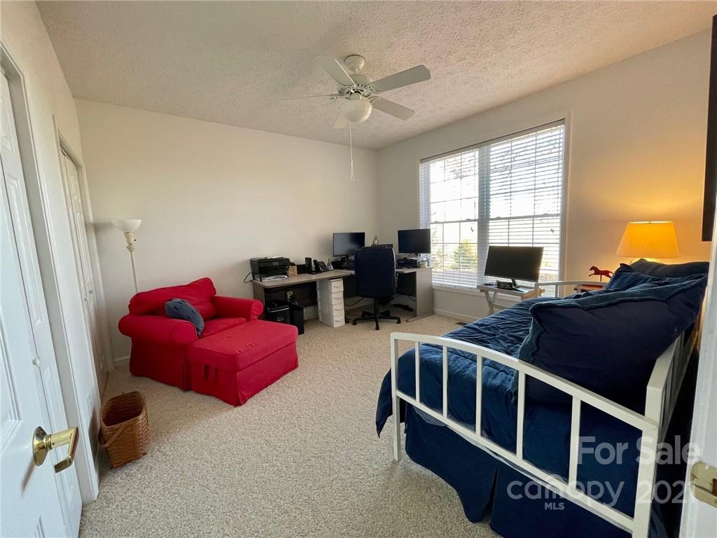 85 Moore Road Tryon, NC 28782 - Photo 14 of 20 a living room with furniture windows and a flat screen tv
