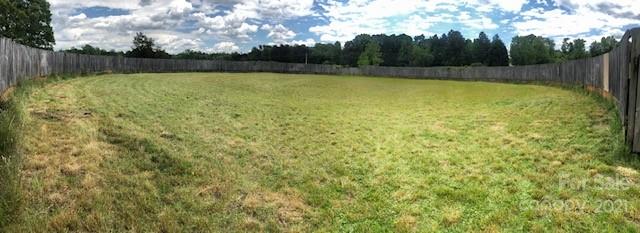 85 Moore Road Tryon, NC 28782 - Photo 20 of 20 a view of a yard with an outdoor space and wooden fence