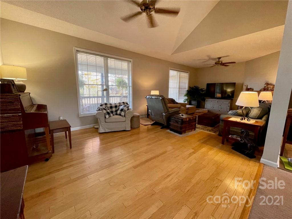 85 Moore Road Tryon, NC 28782 - Photo 5 of 20 a living room with furniture ceiling fan and a window