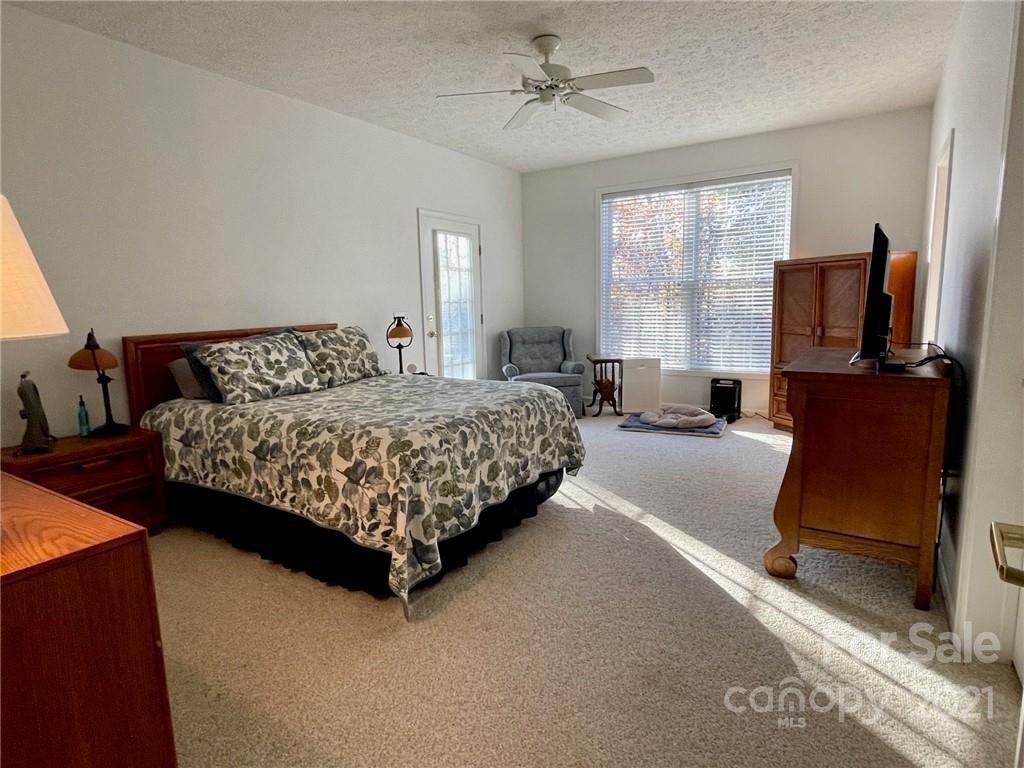 85 Moore Road Tryon, NC 28782 - Photo 9 of 20 a bedroom with bed and window
