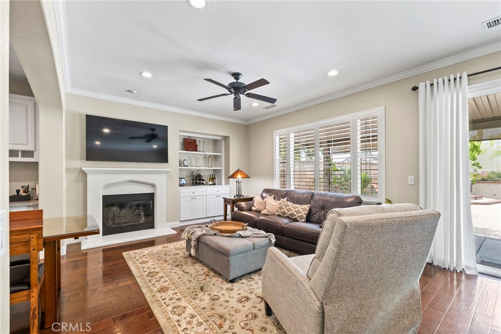 1705 Arthur Loop West Upland, CA 91784 - Photo 10 of 30 Family room w/ Cozy fireplace and view of backyard