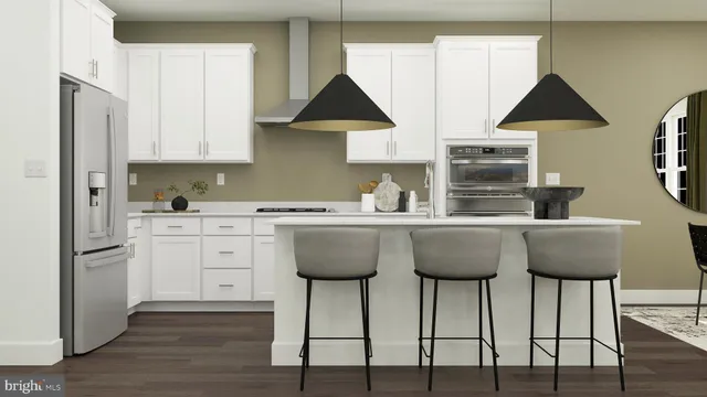 a kitchen with stainless steel appliances granite countertop a dining table chairs and white cabinets