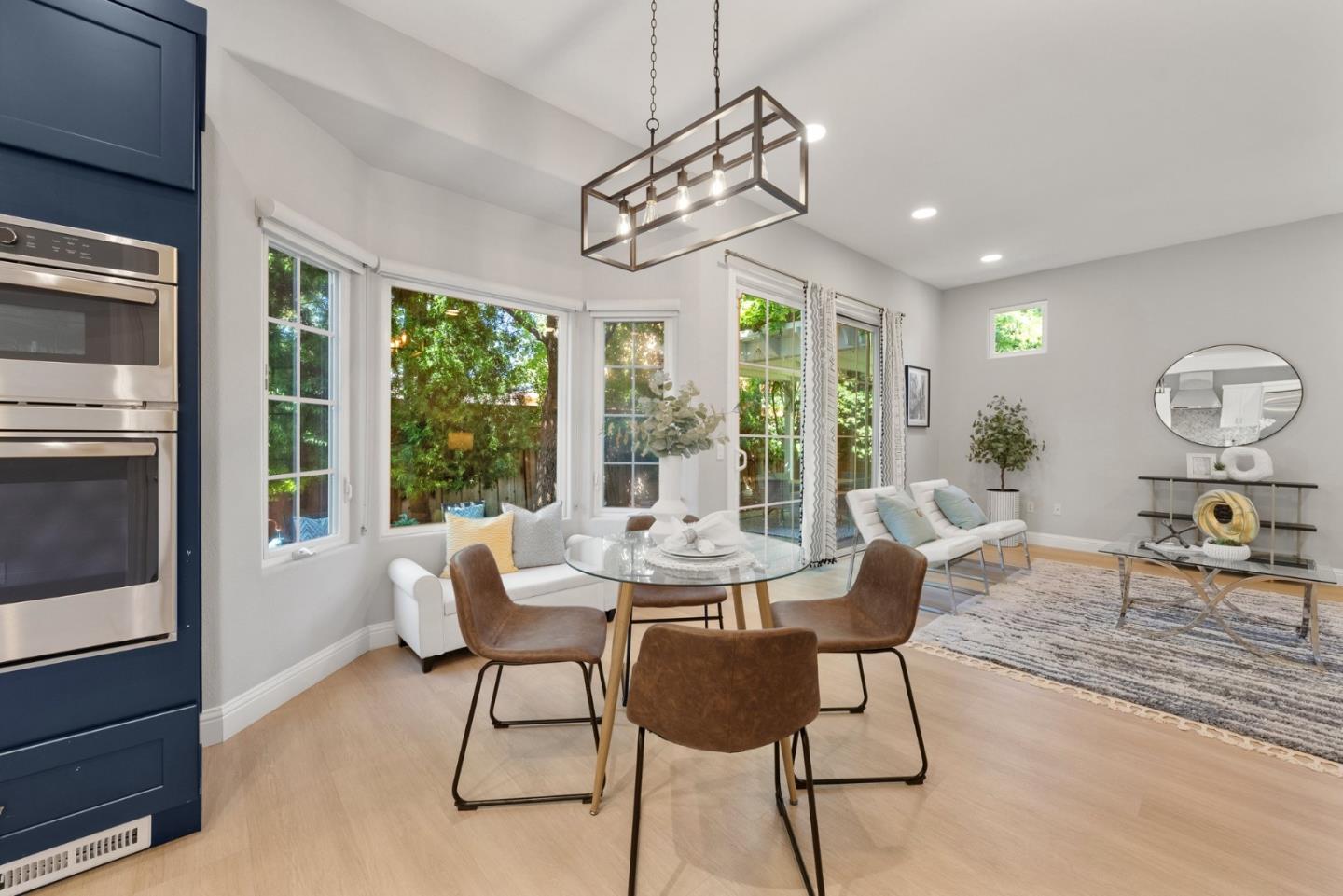 1173 Elysian Place San Jose, CA 95125 - Photo 19 of 60 a dining room with furniture a chandelier and wooden floor