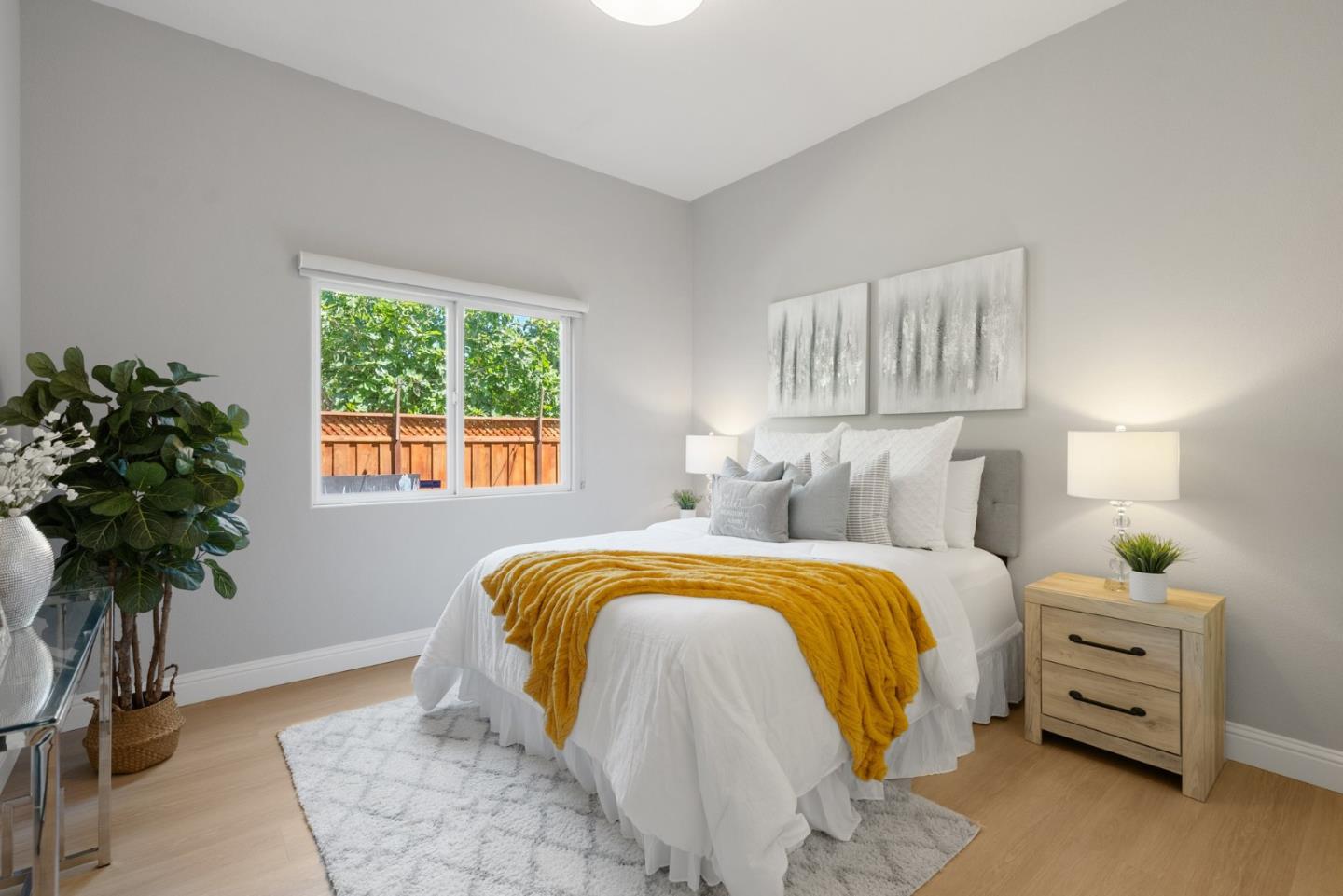 1173 Elysian Place San Jose, CA 95125 - Photo 23 of 60 a bedroom with a bed and a potted plant
