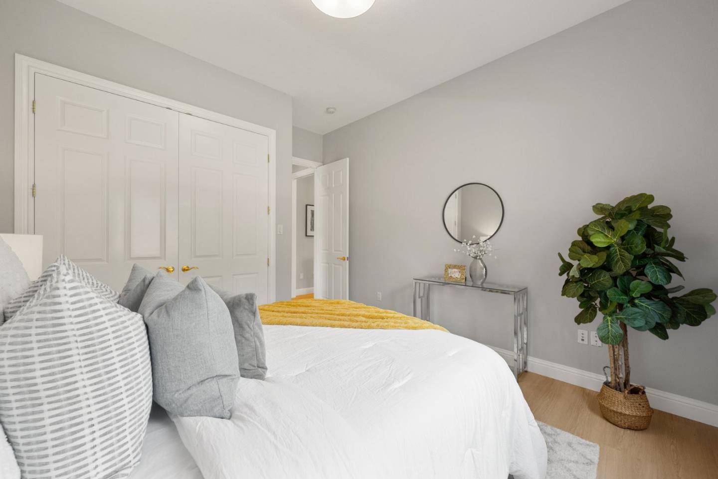 1173 Elysian Place San Jose, CA 95125 - Photo 24 of 60 a bedroom with bed and a potted plant