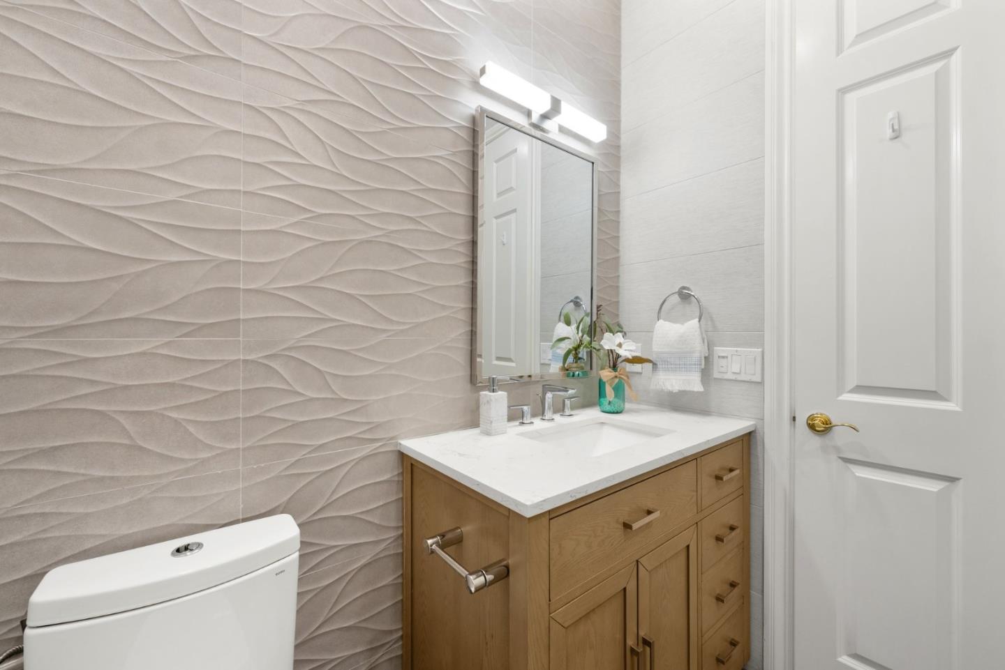 1173 Elysian Place San Jose, CA 95125 - Photo 26 of 60 a bathroom with a sink and a mirror