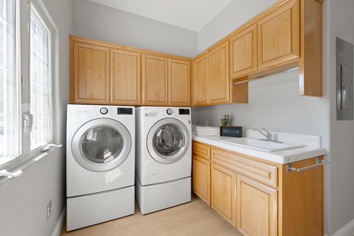 1173 Elysian Place San Jose, CA 95125 - Photo 47 of 60 a utility room with sink dryer and washer