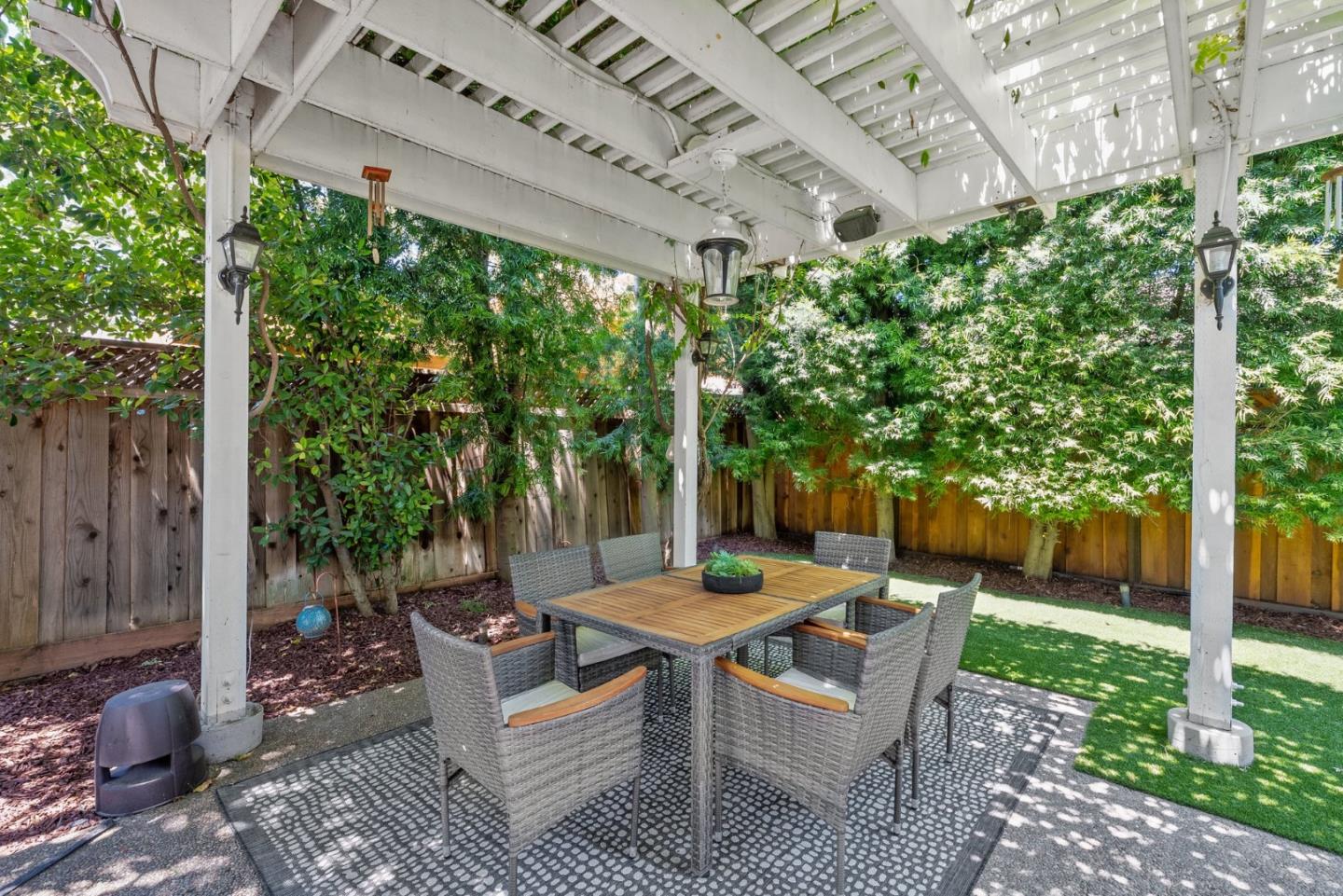 1173 Elysian Place San Jose, CA 95125 - Photo 50 of 60 a view of a patio with table and chairs potted plants and large tree