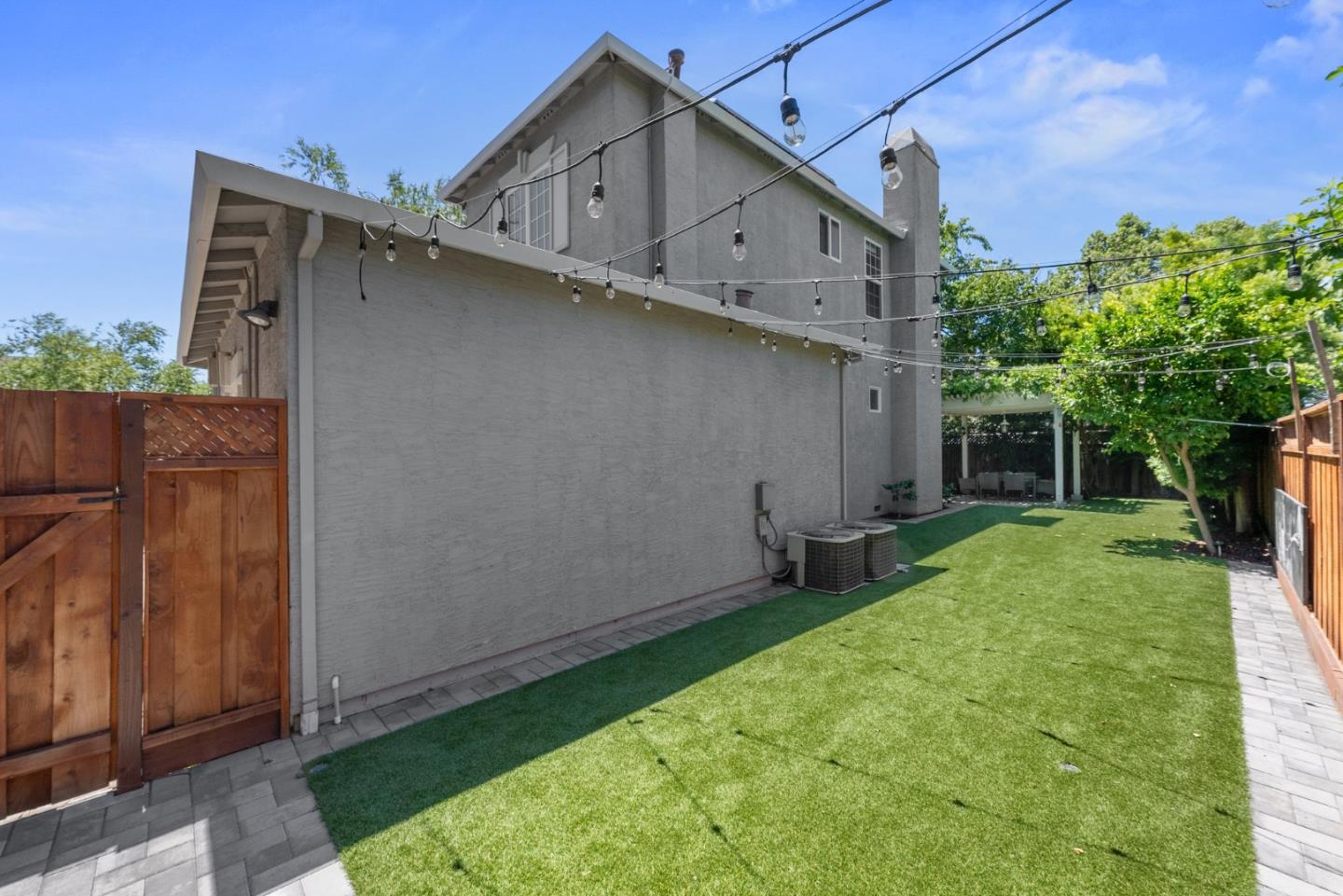 1173 Elysian Place San Jose, CA 95125 - Photo 56 of 60 a backyard of a house with wooden fence and large trees