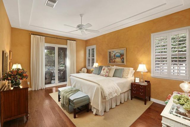 a spacious bedroom with a bed and a couch