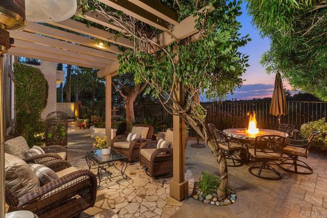 a view of a chairs and table in a patio