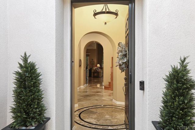 a view of a bathroom with a toilet sink and a mirror
