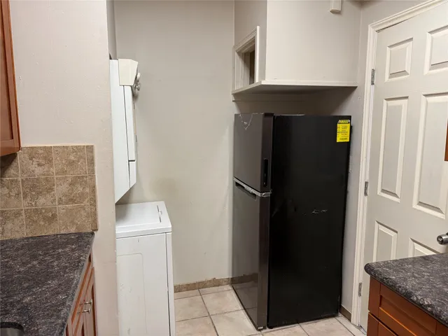 a kitchen with stainless steel appliances granite countertop a sink stove and microwave
