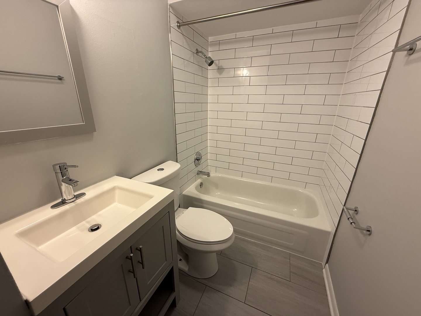 744 West Gordon Terrace, Unit 304 Chicago, IL 60613 - Photo 12 of 12 a bathroom with a sink a toilet and shower