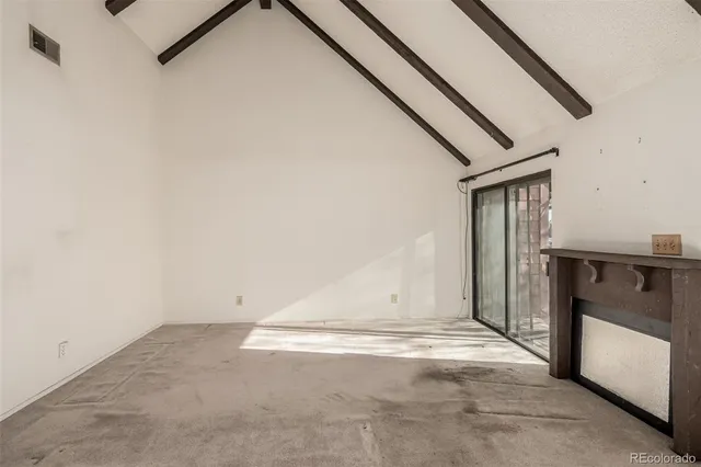 a view of room with stairs and ventilation