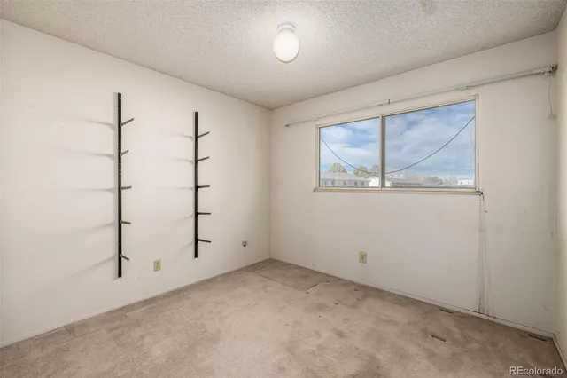 a view of storage and utility room with washer and dryer