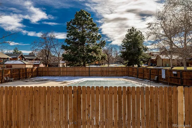 a view of swimming pool with outdoor seating