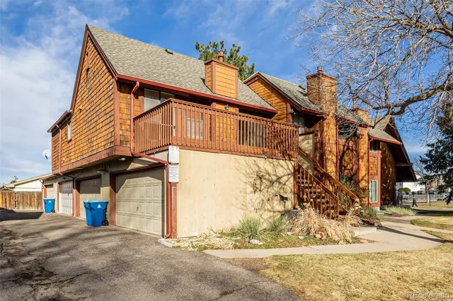 a view of a house with snow on the road