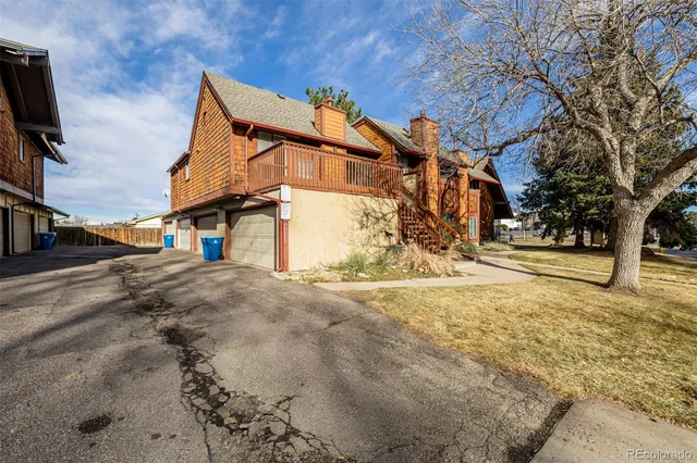 a view of a house with snow on the road