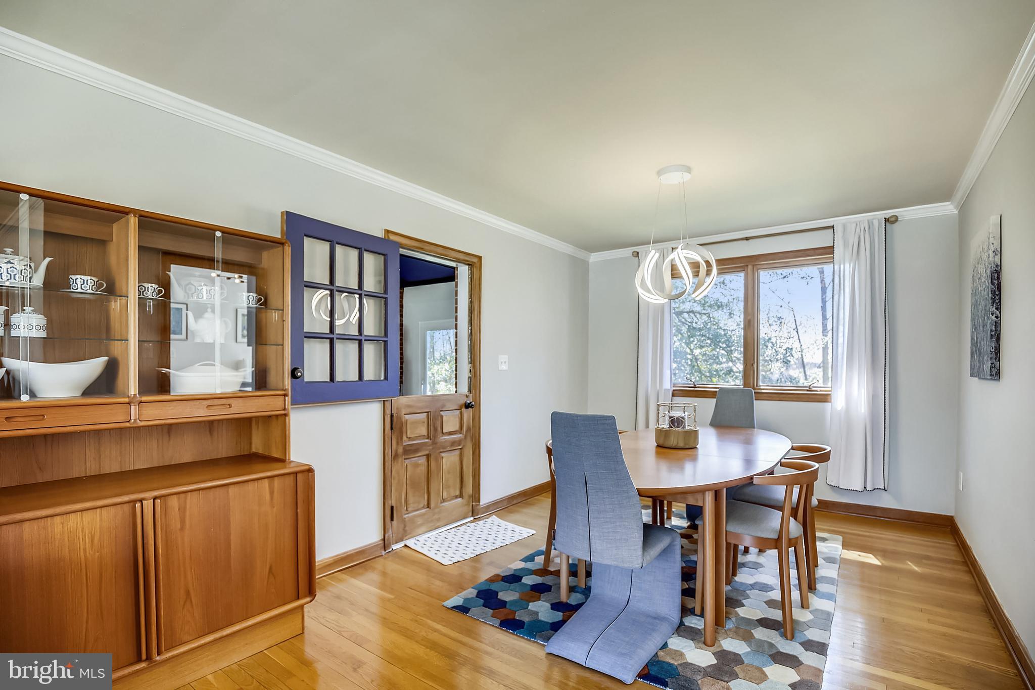 400 Stonington Road Silver Spring, MD 20902 - Photo 14 of 66 a view of a dining room with furniture window and wooden floor