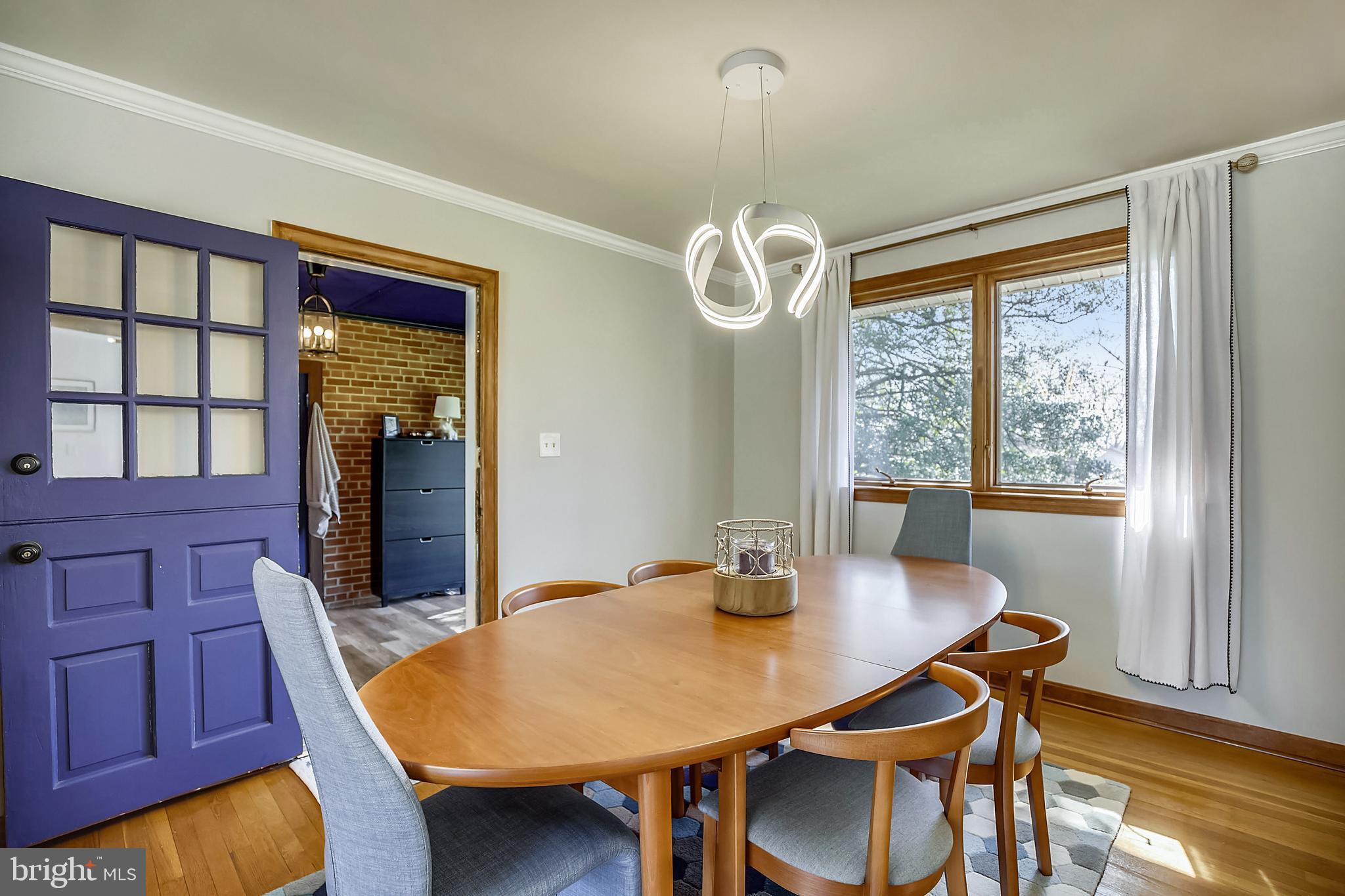 400 Stonington Road Silver Spring, MD 20902 - Photo 15 of 66 a view of a dining room with furniture window and wooden floor