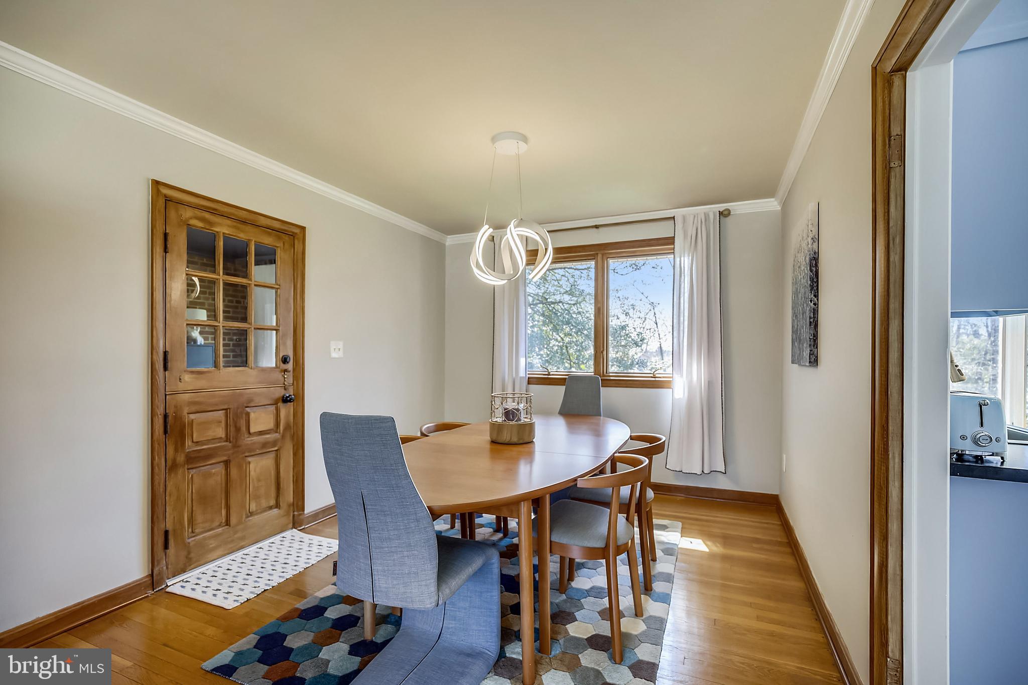 400 Stonington Road Silver Spring, MD 20902 - Photo 16 of 66 a view of a dining room with furniture and wooden floor