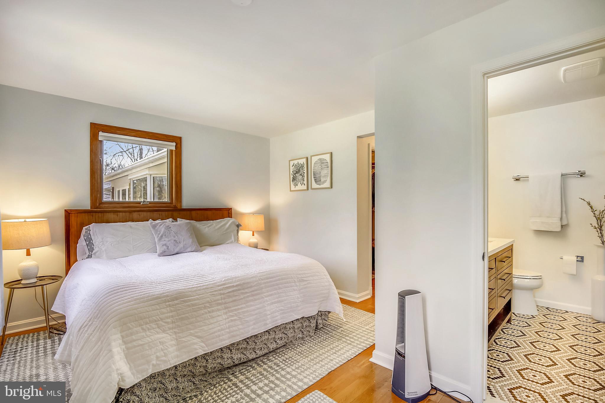 400 Stonington Road Silver Spring, MD 20902 - Photo 20 of 66 a bedroom with a bed and wooden floor