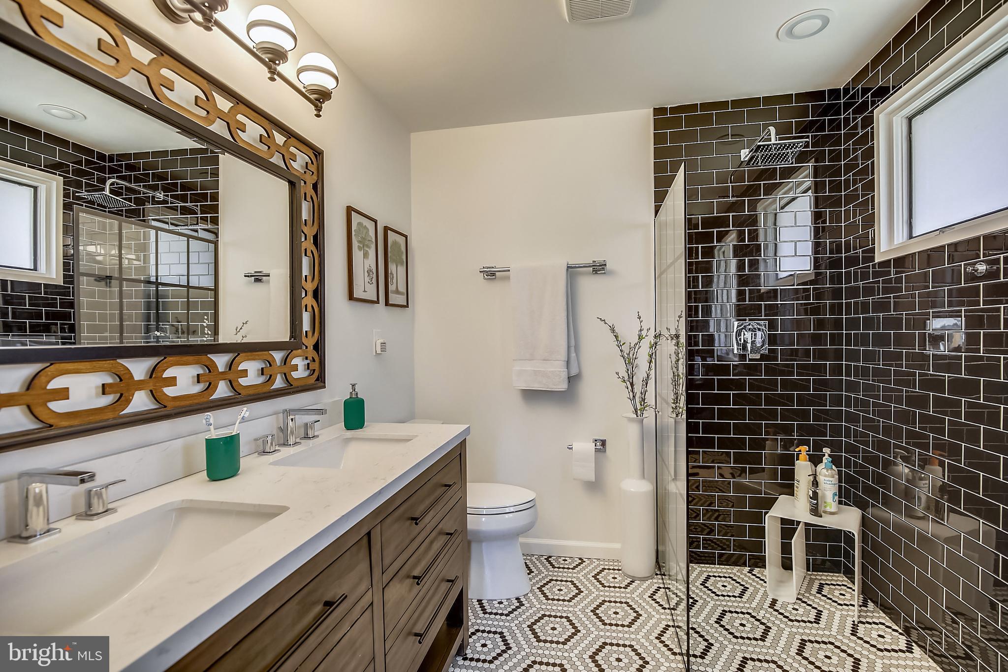 400 Stonington Road Silver Spring, MD 20902 - Photo 23 of 66 a bathroom with a sink a toilet and shower