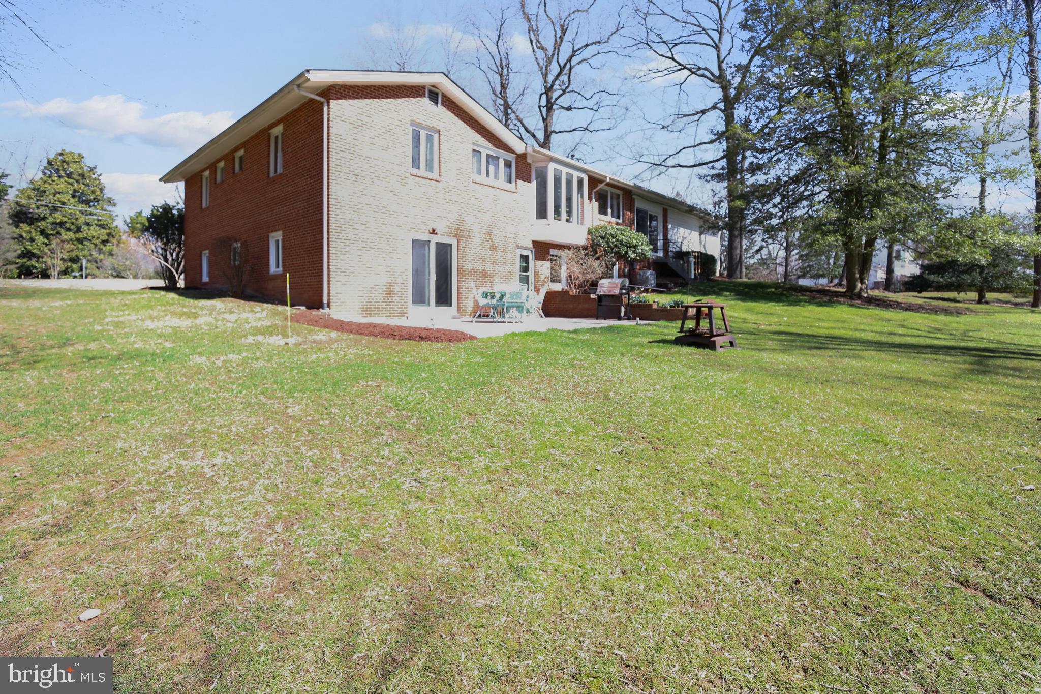 400 Stonington Road Silver Spring, MD 20902 - Photo 31 of 66 a view of a house with backyard and a tree