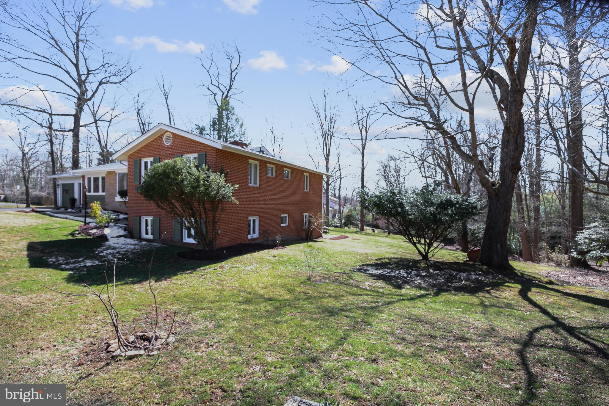 400 Stonington Road Silver Spring, MD 20902 - Photo 32 of 66 a backyard of a house with lots of green space
