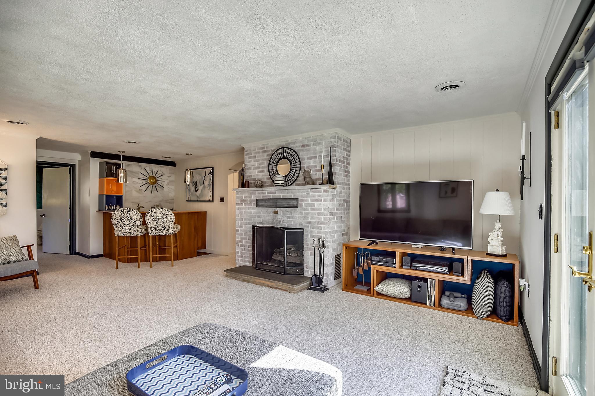 400 Stonington Road Silver Spring, MD 20902 - Photo 34 of 66 a living room with furniture and a flat screen tv