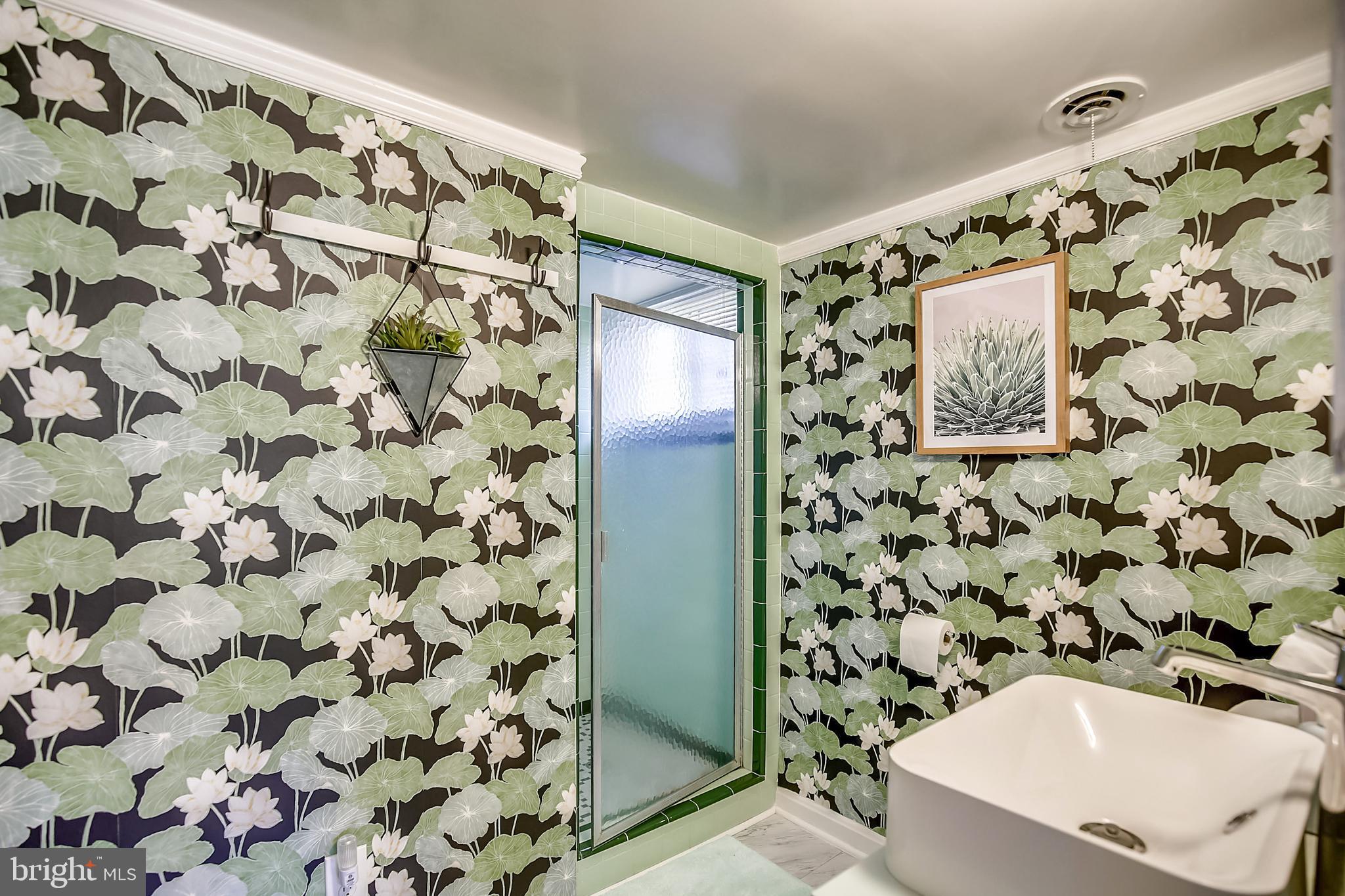 400 Stonington Road Silver Spring, MD 20902 - Photo 43 of 66 a bathroom with a shower curtain