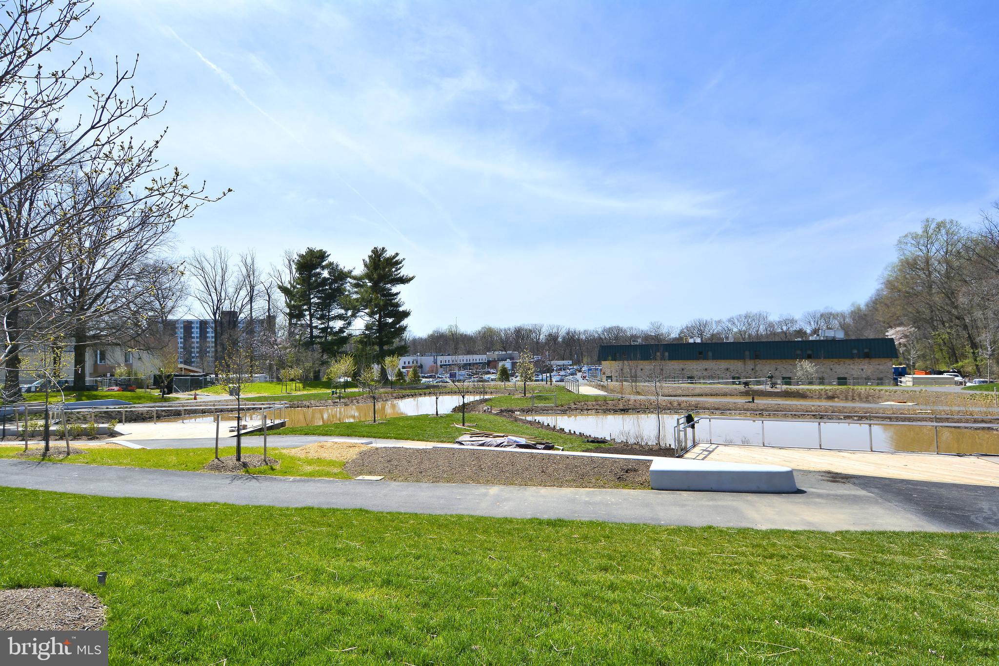 400 Stonington Road Silver Spring, MD 20902 - Photo 57 of 66 a view of a swimming pool with an outdoor seating and yard