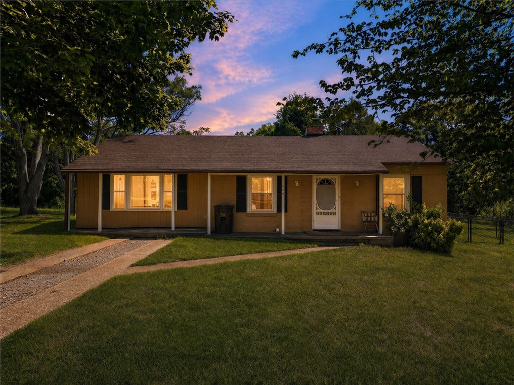 This charming residence features a classic design with an inviting front entrance.
