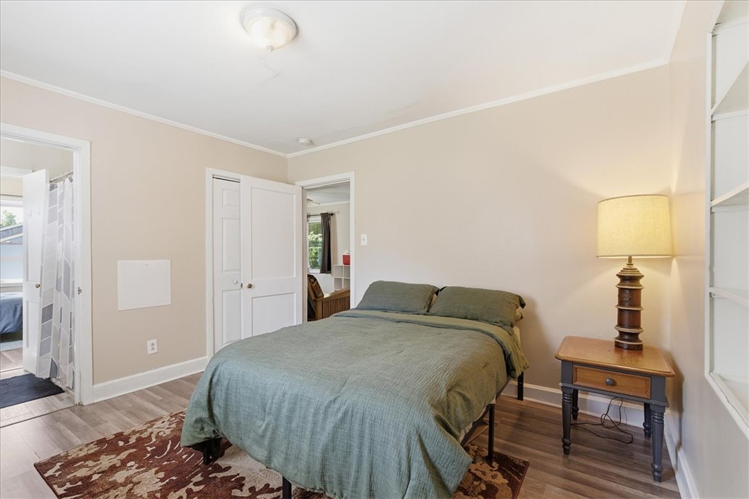 307 South Elm Street Pendleton, SC 29670 - Photo 17 of 41 This cozy bedroom features durable flooring and direct access to an adjacent bathroom.
