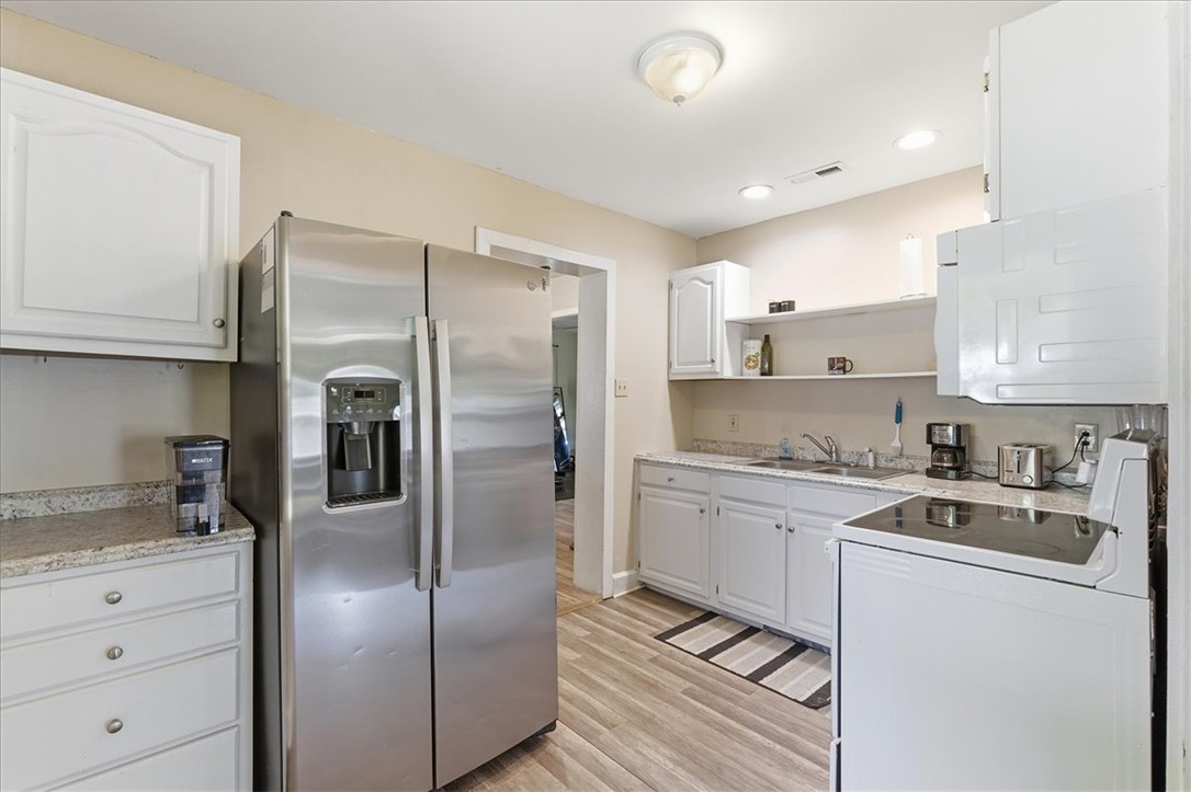 307 South Elm Street Pendleton, SC 29670 - Photo 18 of 41 This bright kitchen features modern appliances and ample storage space, perfect for culinary endeavors.