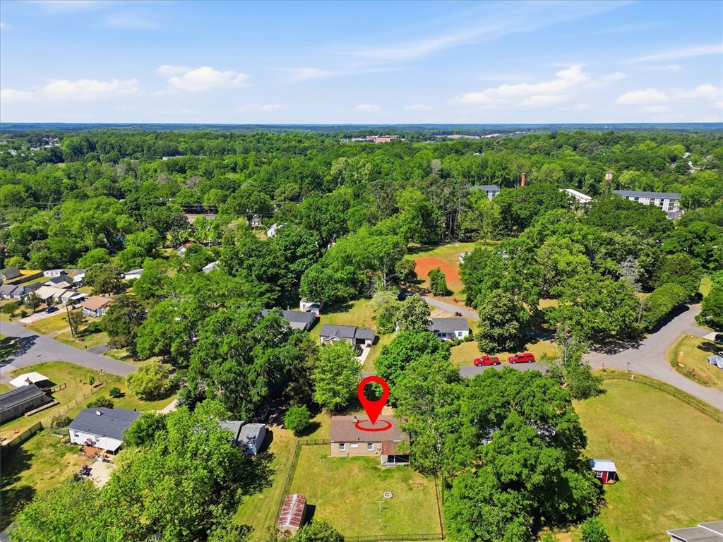 307 South Elm Street Pendleton, SC 29670 - Photo 2 of 41 An inviting property awaits, nestled amidst a lush green landscape.