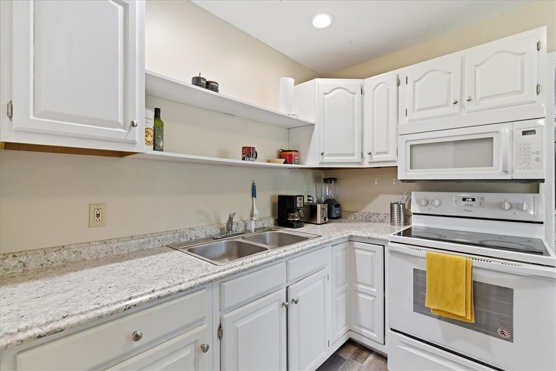 307 South Elm Street Pendleton, SC 29670 - Photo 22 of 41 This functional kitchen features ample counter space and classic white cabinetry.