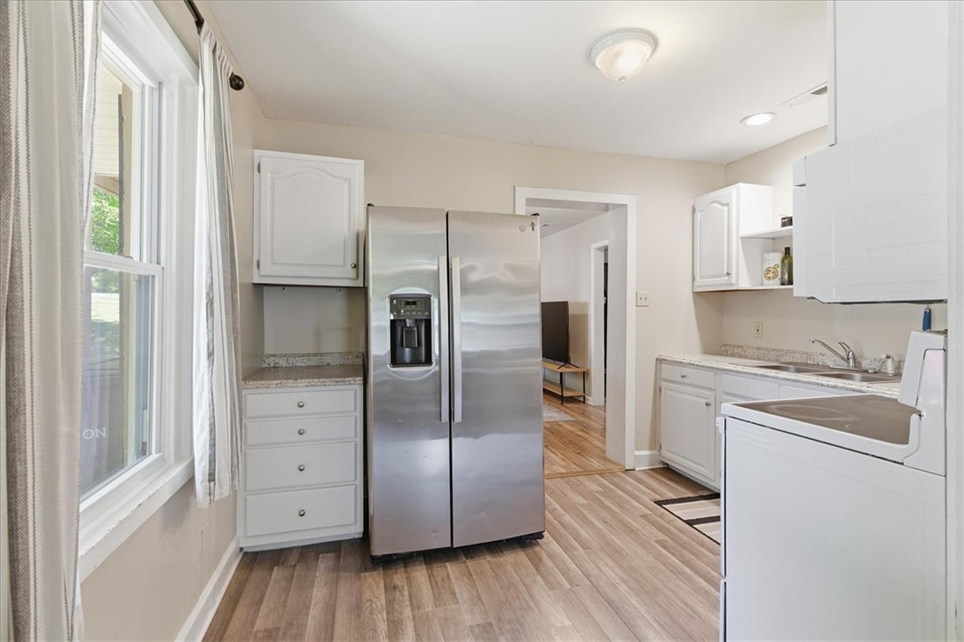 307 South Elm Street Pendleton, SC 29670 - Photo 23 of 41 This bright kitchen features ample counter space and storage, perfect for culinary endeavors.