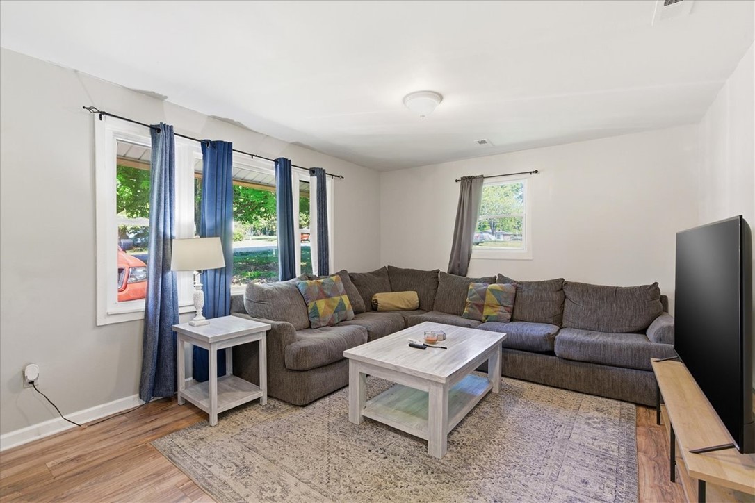 307 South Elm Street Pendleton, SC 29670 - Photo 24 of 41 This living room provides a warm and inviting space for relaxation.
