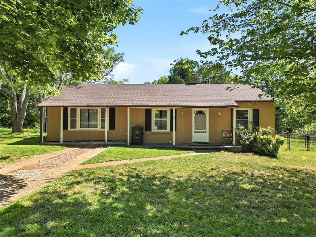 307 South Elm Street Pendleton, SC 29670 - Photo 3 of 41 This charming residence offers a welcoming facade with a classic design.