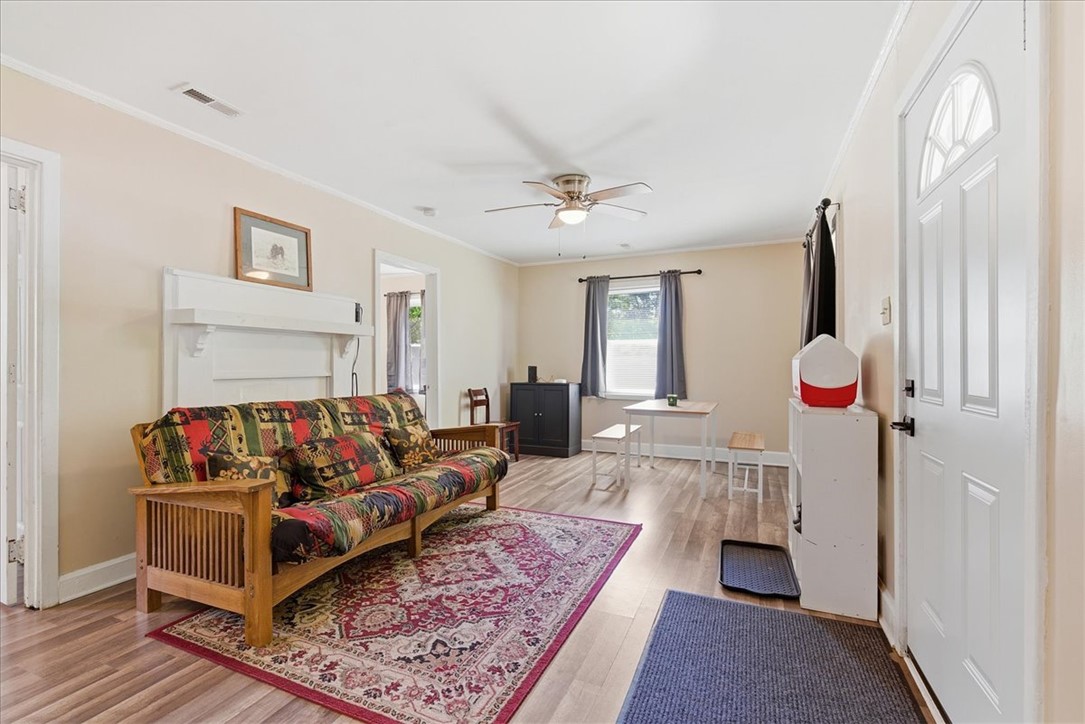 307 South Elm Street Pendleton, SC 29670 - Photo 9 of 41 This inviting living space features warm flooring and ample natural light, perfect for everyday living.