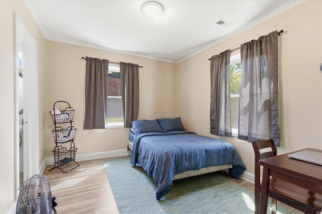 307 South Elm Street Pendleton, SC 29670 - Photo 10 of 41 This cozy bedroom features light-colored walls and bright windows, creating a peaceful and inviting atmosphere.