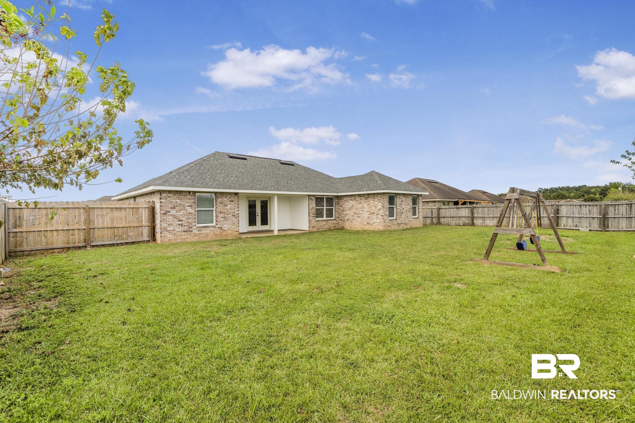 21580 Talbot Lane Robertsdale, AL 36567 - Photo 4 of 25 Rear view of property with a fenced backyard, a patio, brick siding, french doors, and roof with shingles