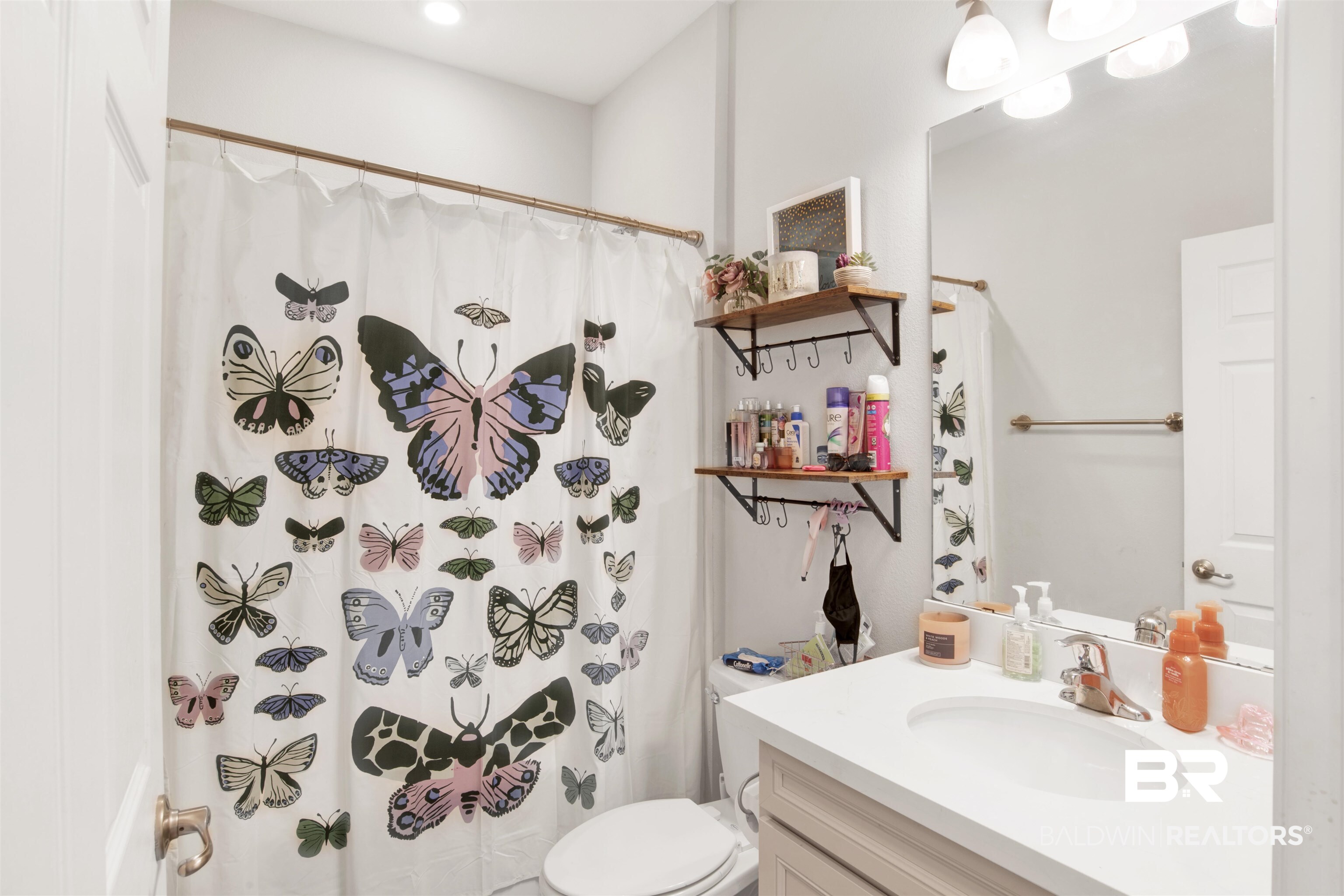 1742 Versant Loop Foley, AL 36535 - Photo 20 of 23 Bathroom with vanity, curtained shower, and toilet