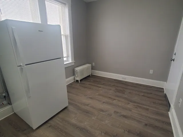 a white refrigerator freezer sitting in a kitchen