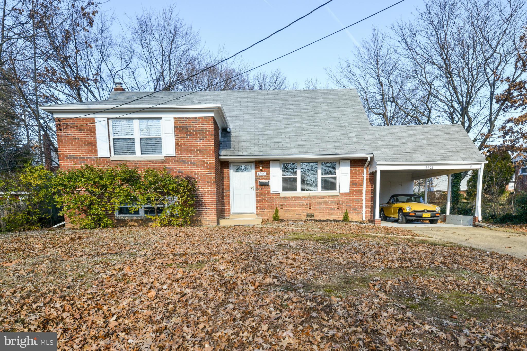 6902 Highland Street Springfield, VA 22150 - Photo 2 of 24 a house view with a sitting space and garden space